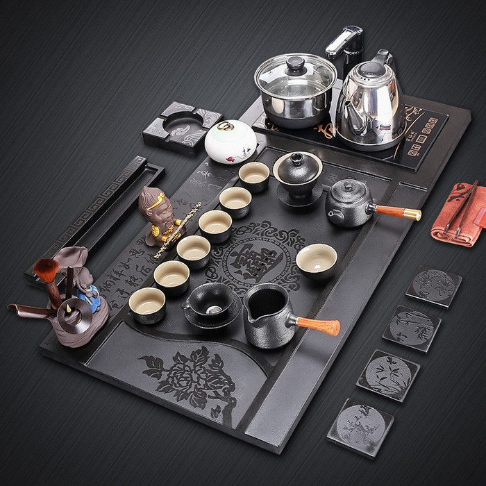 廠家直銷烏金石茶盤套裝 四合一設(shè)計(jì)帶電磁爐，家用茶臺(tái)定制新選擇